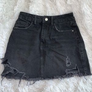 Black distressed denim skirt